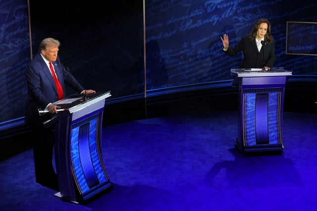 Democratic presidential nominee, U.S. Vice President Kamala Harris speaks during a presidential debate hosted by ABC as Republican presidential nominee, former U.S. President Donald Trump listens, in Philadelphia, Pennsylvania, U.S., September 10, 2024. REUTERS/Brian Snyder/File Photo