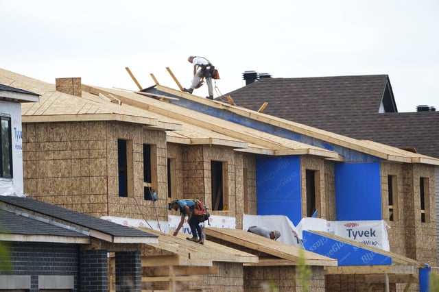 New homes are constructed in Ottawa on Monday, Aug. 14, 2023. The federal government is planning to launch a catalogue of pre-approved home designs to speed up the homebuilding process for developers.