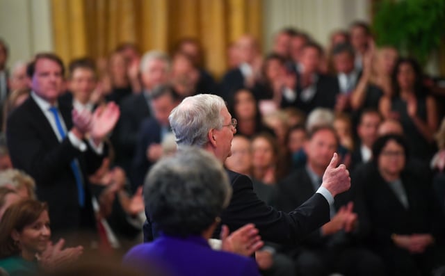 Senate Majority Leader Mitch McConnell, R-Ky., gives a thumbs up to President Donald Trump during an Oct. 8, 2018, ceremonial swearing-in held at the East Room of the White House for newly confirmed Supreme Court Justice Brett Kavanaugh.