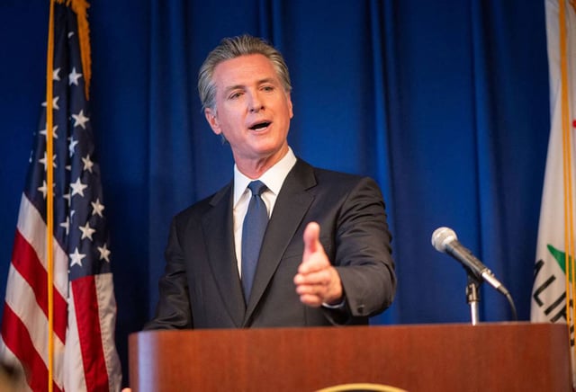 California Gov. Gavin Newsom answers questions from the media Sept. 4, 2024, at a California Department of Justice press conference in Sacramento, California. Newsom signed several bills on Tuesday aimed at regulating the use of artificial intelligence in elections and the entertainment industry. Nathaniel Levine/The Sacramento Bee/TNS/ABACAPRESS.COM/REUTERS