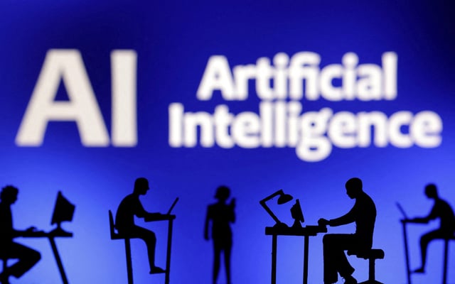 Figurines with computers and smartphones are seen in front of the words "Artificial Intelligence AI" in this illustration taken, February 19, 2024. REUTERS/Dado Ruvic/Illustration