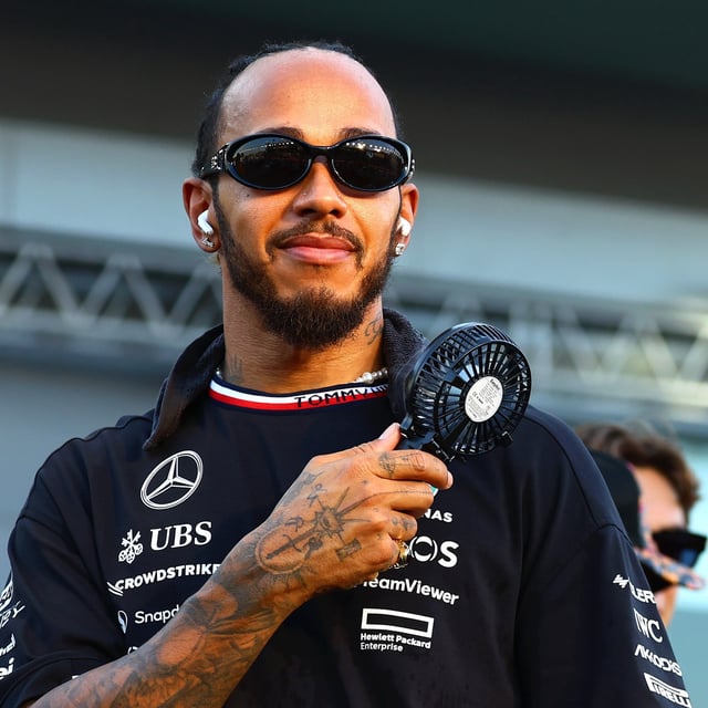 Lewis Hamilton of Great Britain and Mercedes looks on from the drivers parade prior to the F1 Grand Prix of Singapore at Marina Bay Street Circuit on September 22, 2024 in Singapore, Singapore. Lewis Hamilton opens up on his ongoing mental struggles.
