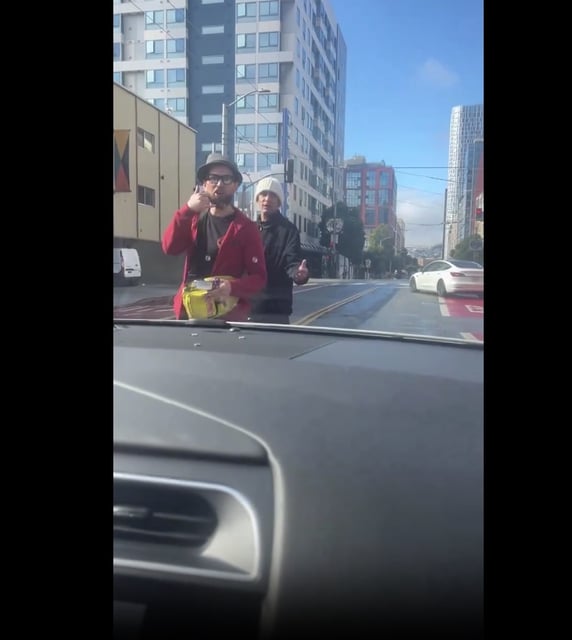 Two men who stopped a woman traveling in a Waymo vehicle in San Francisco’s SoMa neighborhood. The woman said the men were attempting to get her phone number. 
