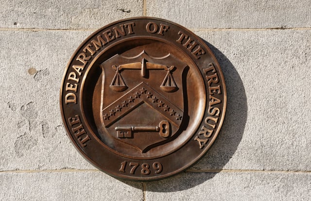 A bronze seal for the Department of the Treasury is shown at the U.S. Treasury building in Washington, U.S., January 20, 2023.  REUTERS/Kevin Lamarque/File Photo