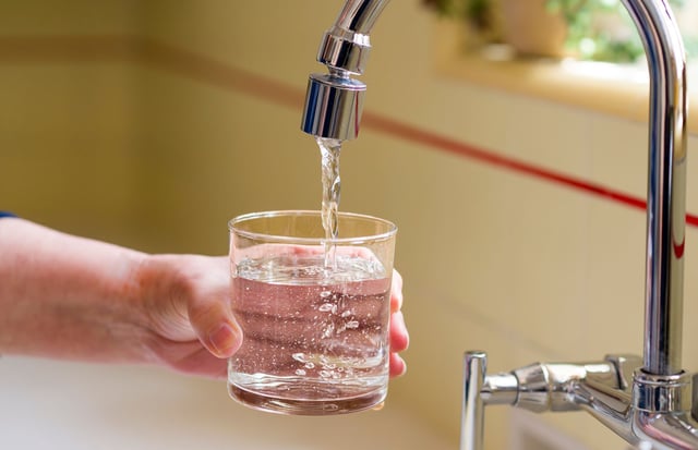 SANTA ANA, CA - APRIL 26: Pouring a glass of water from a kitchen faucet in Santa Ana on Friday, April 26, 2024. According to a study by the US Geological Survey, 45% of the tap water in the United States is contaminated with "forever chemicals" that are considered dangerous to human health.  In recent years, studies have found that humans exposed to some PFAS chemicals are more prone to everything from high cholesterol and hypertension to testicular cancer, breast cancer and, for girls, early-onset puberty.  (Photo by Leonard Ortiz/MediaNews Group/Orange County Register via Getty Images)