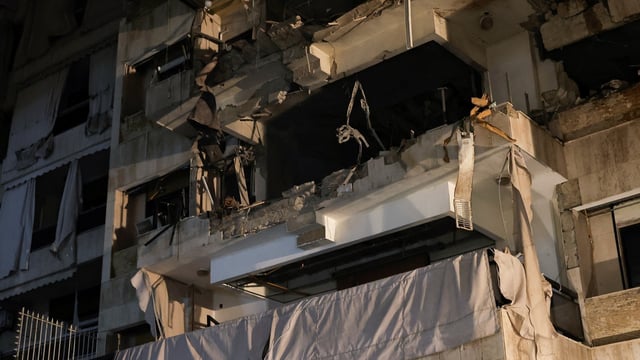 A damaged building stands at the site of an Israeli air strike, amid ongoing hostilities between Hezbollah and Israeli forces, in Beirut, Lebanon,