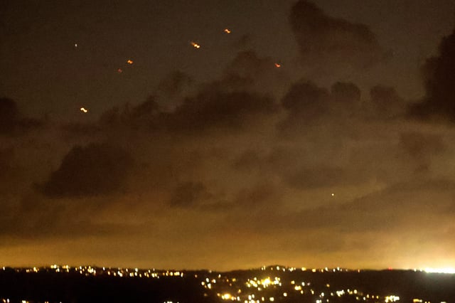 Projectiles fly in the sky after Iran fired a salvo of ballistic missiles at Israel amid ongoing hostilities between Hezbollah and Israeli forces, as seen from Tyre, southern Lebanon on Oct. 1, 2024.