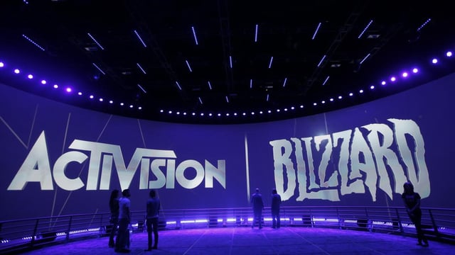 FILE - The Activision Blizzard Booth is shown on June 13, 2013 the during the Electronic Entertainment Expo in Los Angeles. Microsoft is buying Activision Blizzard, Tuesday, Jan. 18, 2022, for $68.7 billion to gain access to blockbuster games including Call of Duty and Candy Crush. The all-cash deal will let Microsoft accelerate mobile gaming and provide it building blocks for the metaverse, or a virtual environment. (AP Photo/Jae C. Hong, File)