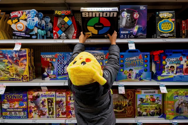 A child looks at toys in a Target store ahead of the Thanksgiving holiday and traditional Black Friday sales in Chicago, Illinois, U.S. November 21, 2023. REUTERS/Vincent Alban/File Photo