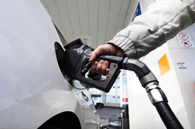 The national price on pollution will rise by $15 per tonne today for consumers, small and medium-sized businesses, First Nations, as well as public-sector operations such as hospitals, universities, schools and municipalities. A person pumps gas at a gas station in Mississauga, Ont.,  Tuesday, February 13, 2024. 