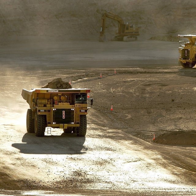 Dump trucks haul dirt at Barrick's Ruby Hill Mine Feb. 14, 2006, outside Eureka, Nev.