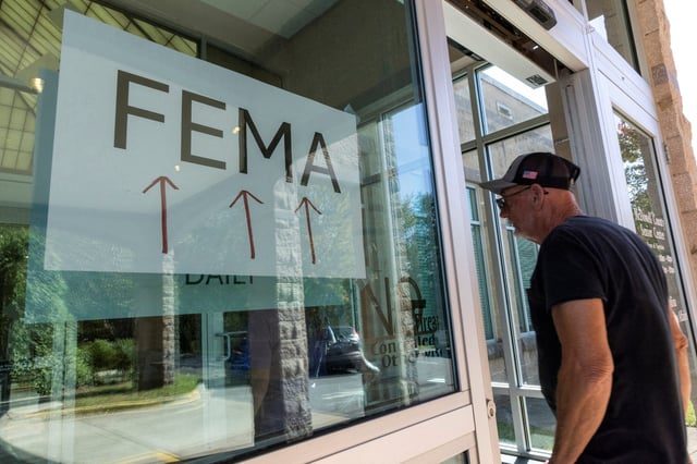 A resident enters a temporary station in Marion, N.C., for the Federal Emergency Management Agency on Oct. 5, 2024, after Hurricane Helene.
