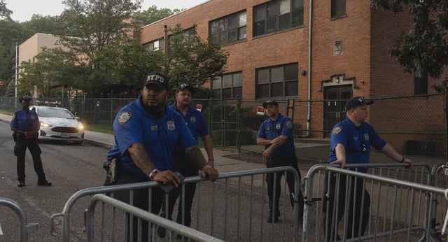 Staten Island residents of the Arrochar neighborhood, joined by right-wing political activists, hold a rally to protest New York City plans to house migrants in a closed Catholic school, St John Villa Academy, on Sept. 5, 2023.
