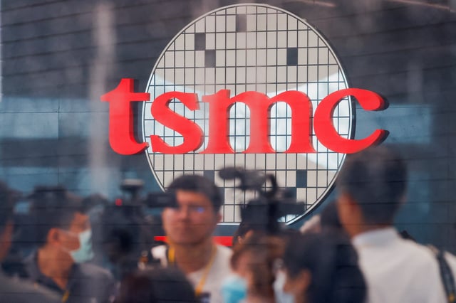Taiwan Semiconductor Manufacturing Company's (TSMC) logo is seen while people attend the opening of the TSMC global R&D center in Hsinchu, Taiwan July 28, 2023. REUTERS/Ann Wang/File Photo
