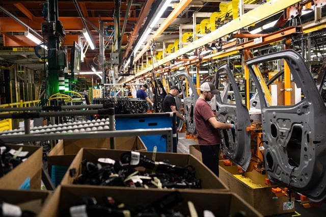 Workers assemble vehicle doors at the General Motors assembly plant in Fort Wayne, Indiana, in an April file photo.