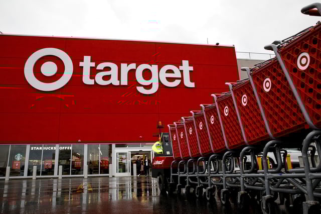 Shoping carts are wheeled outside a Target Store during Black Friday sales in Brooklyn, New York, U.S., November 26, 2021.  REUTERS/Brendan McDermid/File Photo