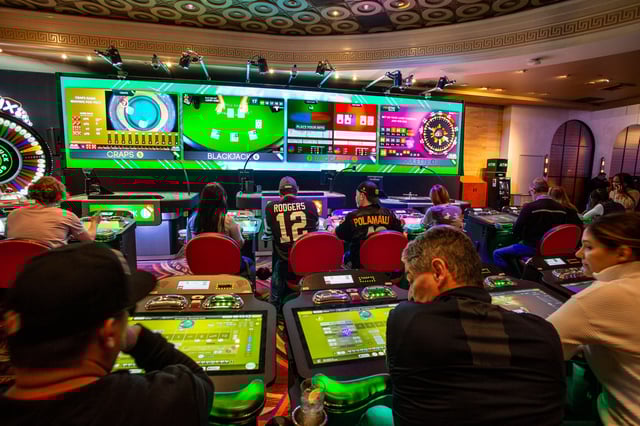 Gamblers at Caesars Palace Hotel & Casino have multiple choices of automated video games including roulette, baccarat, blackjack, and craps, on Feb. 12, 2023 in Las Vegas.