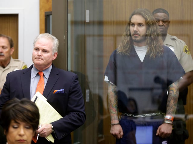 Tim Lambesis, right, listens to his lawyer Anthony Salerno speak during his arraignment in San Diego North County court in Vista, California, on May 9, 2013.