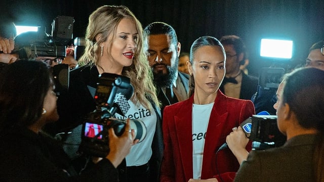 Karla Sofía Gascón, left, stars as reformed mobster Emilia Pérez, with Zoe Saldaña as her lawyer