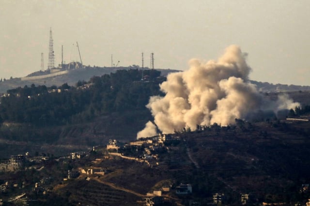 Smoke rises over the southern Lebanese border village of Odaisseh during an Israeli strike on October 26, 2024, amid the ongoing war between Israel and Hezbollah.