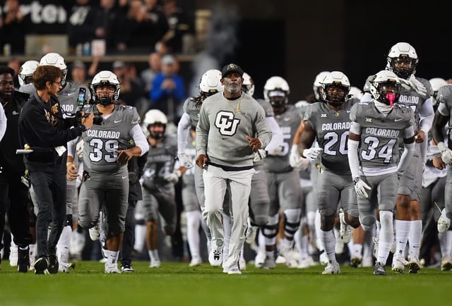 Colorado football coach Deion Sanders leads the team onto the field before the Buffaloes game against Cincinnati Bearcats at Folsom Field in Boulder, Colorado on Oct. 27, 2024.