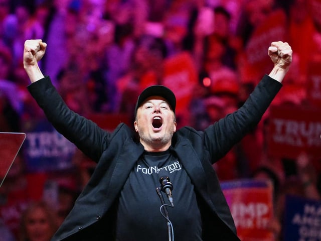 Tesla and SpaceX CEO Elon Musk gestured as he stepped onstage during a campaign rally for former President Donald Trump at Madison Square Garden in New York just days before the election.