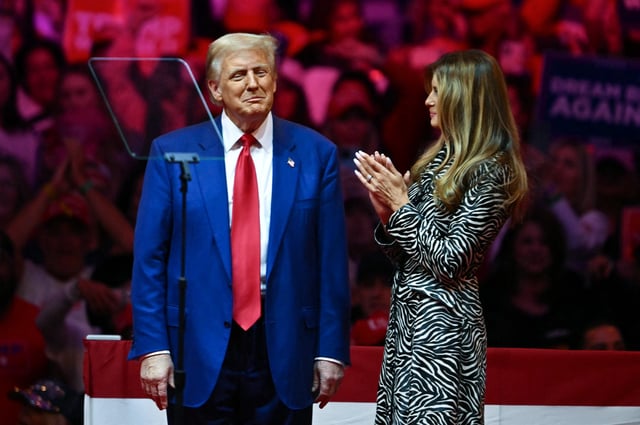 Former US First Lady Melania Trump applauds her husband former US President and Republican presidential candidate Donald Trump after he spoke at a campaign rally at Madison Square Garden in New York, October 27, 2024.