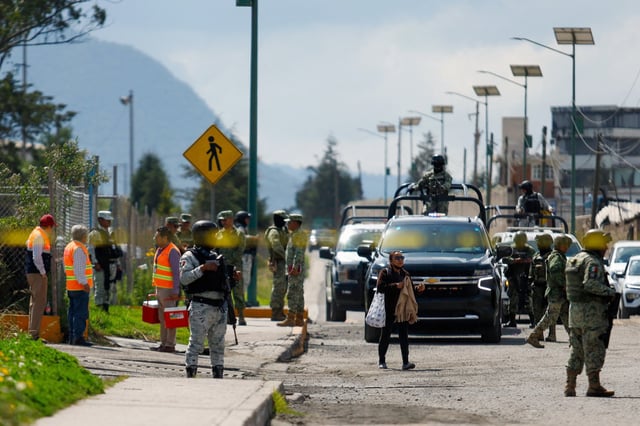 Members of the National Guard and Mexican soldiers watch the entrance after an explosion in a tower of the Aceros Simec complex in the municipality of Xalostoc, State of Tlaxcala, Mexico, on Oct. 30, 2024. 