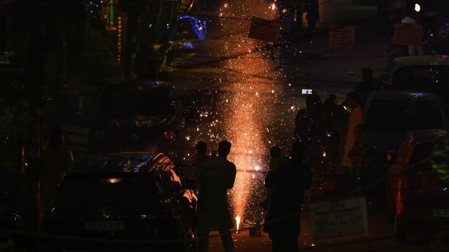 People burst crackers on the occasion of Diwali at Pandav Nagar in New Delhi on October 31. The city's air quality dropped to the very poor category, with an Air Quality Index (AQI) of 330 at 10 pm.