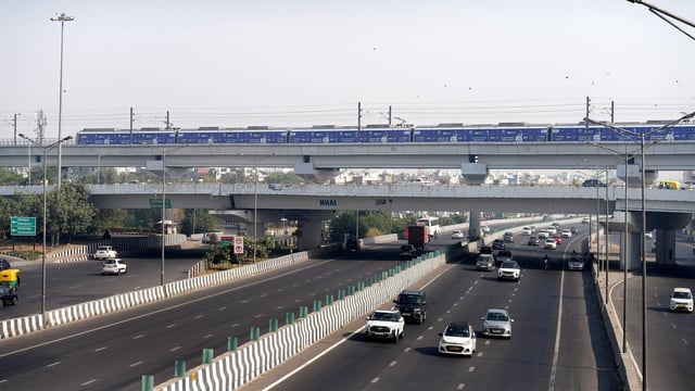 Vehicles move on a road as air quality continues to remain poor, a day after Diwali festival celebrations, in New Delhi, Friday morning,