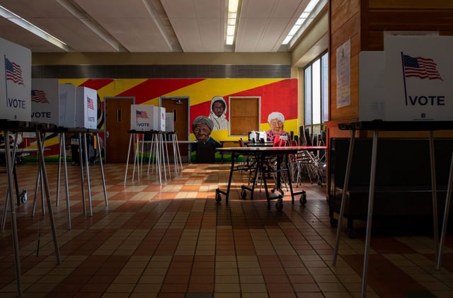 Empty voting booths rest inside Osborn High School's polling place during the presidential primary in Detroit on Tuesday, Feb. 27, 2024.