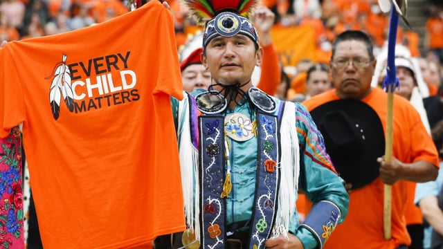FILE - Wab Kinew attends the second annual Orange Shirt Day Survivors Walk and Pow Wow on National Day for Truth and Reconciliation in Winnipeg, Manitoba, Sept. 30, 2022. The Canadian province of Manitoba has elected the first First Nations premier of a province in Canada. Manitobans elected an NDP government led by Wab Kinew, was raised as a young boy on the Onigaming First Nation in northwestern Ontario, later moving with his family to Winnipeg. (John Woods/The Canadian Press via AP)
