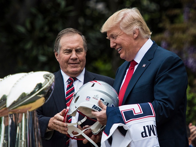 WASHINGTON, DC - APRIL 19: President Donald Trump is presented a New England Patriots helmet and jersey from Patriots head coach Bill Belichick, left, during a ceremony where he honored the Super Bowl Champion New England Patriots for their Super Bowl LI victory on the South Lawn of the White House in Washington, DC on Wednesday, April 19, 2017. (Photo by Jabin Botsford/The Washington Post via Getty Images)