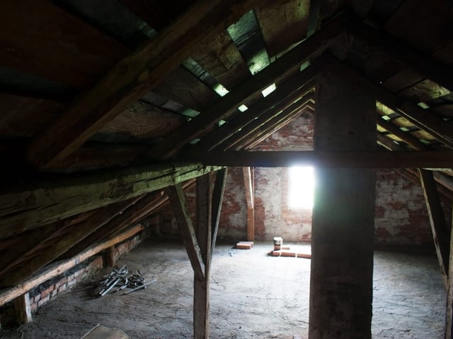 The human remains were found in a hidden cubby in the attic.