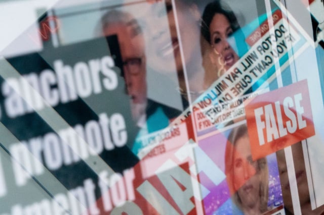 This photo illustration created in Washington, D.C., in 2023, shows shows a fact-checked image of news anchors where the claim about them was found to be false. The FBI announced its takedown of a Russian, AI-powered misinformation bot farm Tuesday.