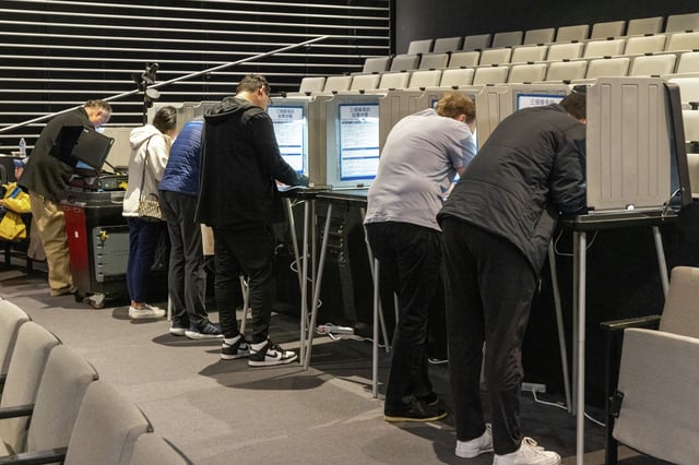 Voters fill out their ballots in a polling place inside an auditorium at the SFMOMA on election day in San Francisco, Calif. on November 5, 2024. California voters approved state Proposition 36, meant to curb crime, by a margin of 70 percentage points, according to early unofficial election results.