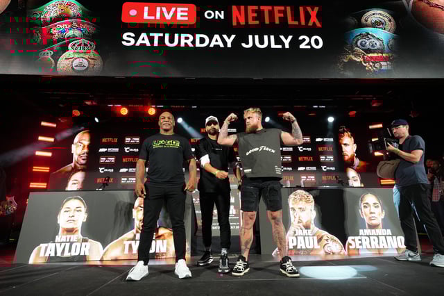 (Left to right) Mike Tyson, Nakisa Bidarian and Jake Paul pose onstage during a press conference to promote their fight on May 16, 2024.