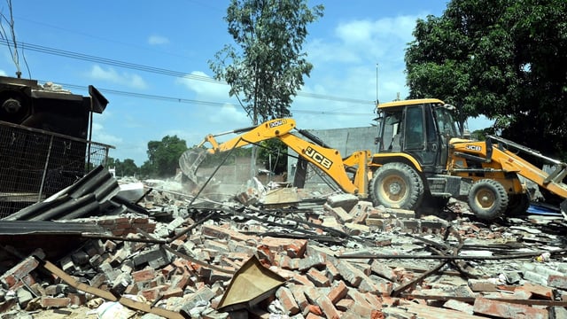 A bulldozer being used to demolish the bakery of Moid Khan who is accused of allegedly raping a 12-year-old girl, in Ayodhya. (File image)