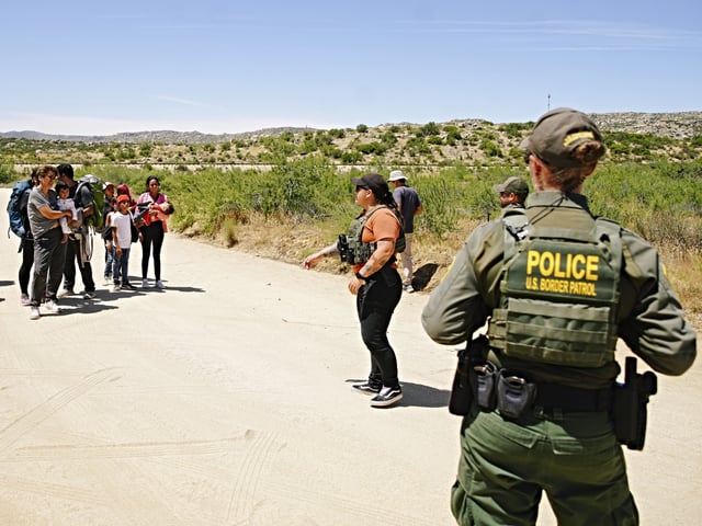 JACUMBA HOT SPRINGS, CALIFORNIA, UNITED STATES - JUNE 10: US Border Patrol police intervene with irregular migrants crosings the border to Jacumba Hot Springs days after US President Joe Biden announced a decree to change migration policy at the border in California, United States on June 10, 2024. Biden rolled out the new executive order, to significantly restrict asylum claims in a bid to stave off Republican criticism of his border policies ahead of November's presidential election. The order goes into effect when there is a seven-day average of 2,500 or more 'border encounters' per day. That includes the southwestern land border and southern US coastal borders. There are already well over 2,500 daily 'border encounters,' meaning the order immediately takes effect. Its restrictions remain in place until two weeks after the number of 'border encounters' dips below 1,500. (Photo by Katie McTiernan/Anadolu via Getty Images)