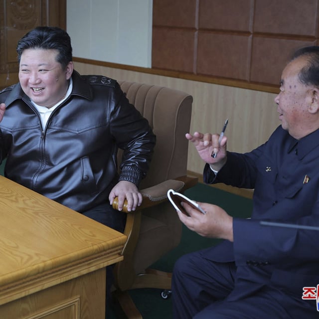 In this photo provided by the North Korean government, its leader Kim Jong Un, left, inspects tests of drones designed to crash into targets, at an undisclosed location in North Korea, Thursday, Nov. 14, 2024. North Korea has tested exploding drones designed to crash into targets, with leader Kim Jong Un now calling for the mass production of the weapons.