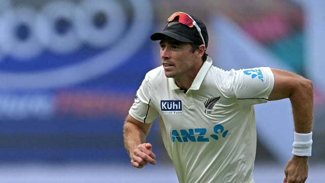 New Zealand's Tim Southee runs to field a ball. (Photo by IDREES MOHAMMED / AFP)