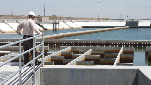 A Phoenix water services worker checks a filtration basin at the city's Union Hills Water Treatment Plant.