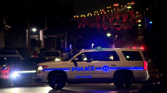 Police respond to the scene of a shooting in New Orleans on Sunday, November 17.