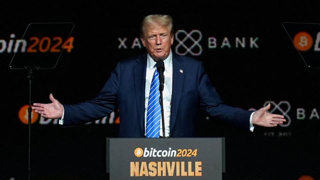 FILE PHOTO: Republican presidential nominee and former U.S. President Donald Trump gestures at the Bitcoin 2024 event in Nashville, Tennessee, U.S., July 27, 2024. REUTERS/Kevin Wurm/File Photo