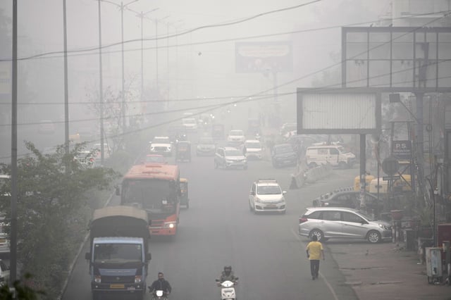 Commuters drive through a thick layer of smog as air pollution shoots up in New Delhi, India, Monday, Nov. 18, 2024. 
