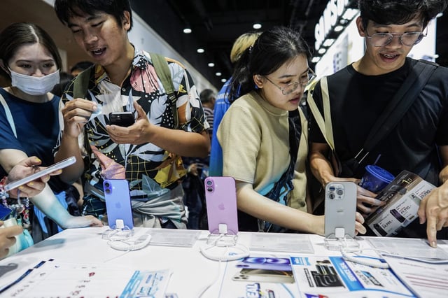 Visitors checking out Apple&#39;s iPhone 16 at the Thailand Mobile Expo 2024 in Bangkok on Oct. 26, 2024. The iPhone 16 is still unavailable for commercial sale in Indonesia.