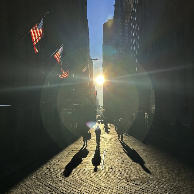 The morning sun shines on Wall Street in New York's Financial District on Tuesday, Nov. 19, 2024. U.S. stocks are slipping Tuesday following escalations in the Russia-Ukraine war.