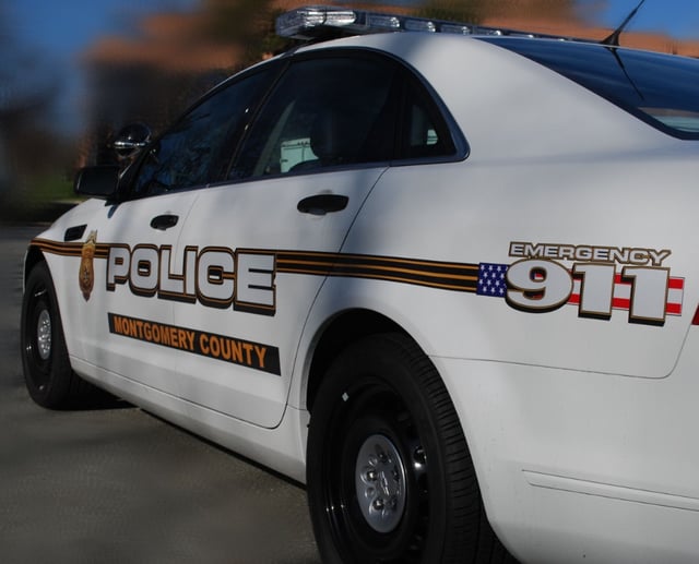 Montgomery County Police Department (Maryland) patrol vehicle at scene.
