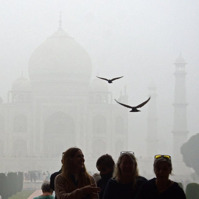 Tourists visit the Taj Mahal on a cold smoggy morning in Agra on November 18, 2024. (Photo by Pawan SHARMA / AFP) (Photo by PAWAN SHARMA/AFP via Getty Images)
