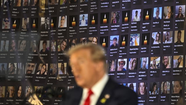 Pictures of hostages and victims are seen as Trump speaks during a remembrance event to mark the first anniversary of the Hamas attack on Israel at Trump National Doral golf club in Miami, Florida, on Oct. 7, 2024. Photo: Chandan Khanna/AFP via Getty Images